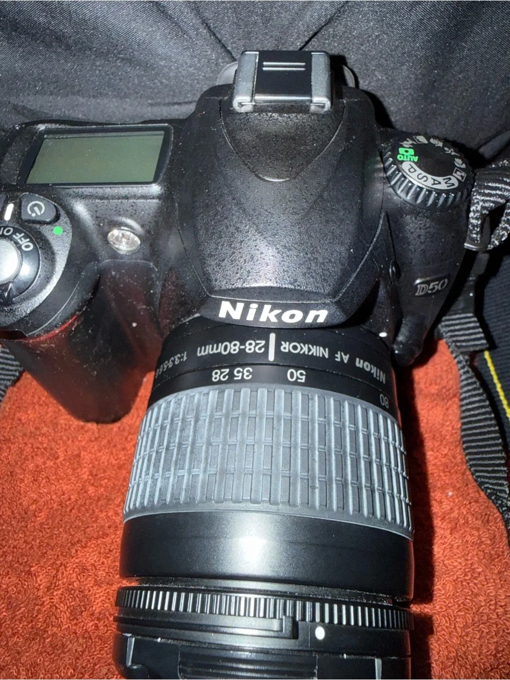 Nikon DSLR Camera Kit with Black Lowepro Bag and Yellow-Accented Strap